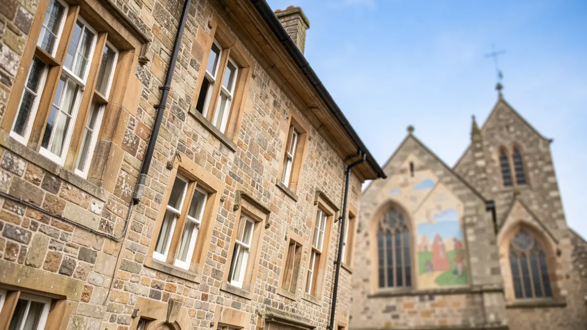 Generic image of a historic building with unique architectural features and a new church in the background.